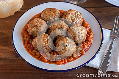 Spanish pisto (typical vegetables stew) with meatballs Stock Photo