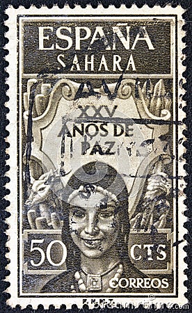 SPANISH SAHARA - CIRCA 1965: A stamp printed in Spain shows a woman in traditional outfit Editorial Stock Photo