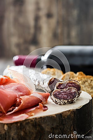 Spanish serrano ham and sausages on a trunk Stock Photo