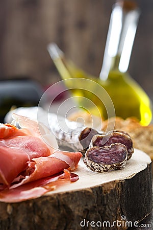 Spanish serrano ham and sausages on a trunk Stock Photo