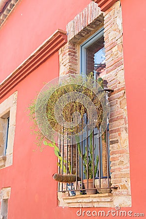 Spanish window with cacti Stock Photo