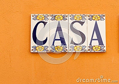 Spanish word CASA meaning house or home tiled on wall Stock Photo