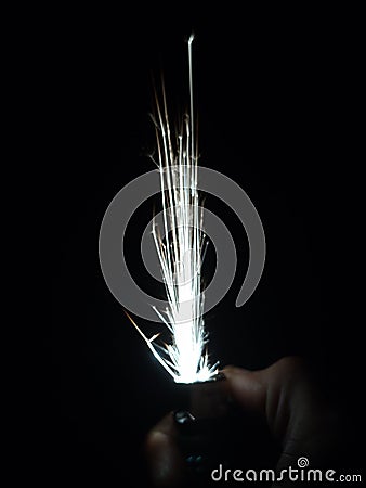 Spark Lighter make fireworks in the dark Stock Photo