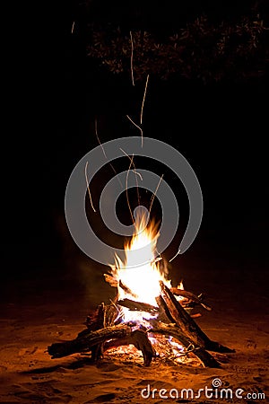 Sparking Camp Fire in the Night Stock Photo