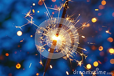 Sparkler Illuminating the Night with Vibrant Sparks Stock Photo