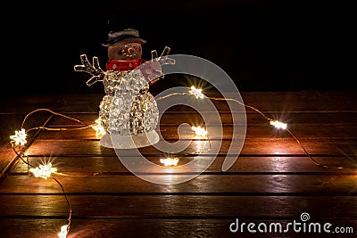 Sparkling christimas lights as illuminated decoration for festive mood on the table create a romantic and shiny atmosphere Stock Photo