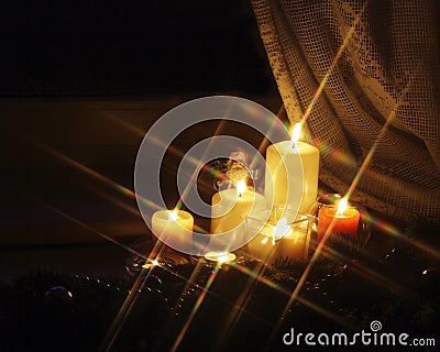 Sparkling Christmas candles and Santa Claus Stock Photo