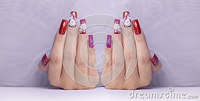 Sparkling red color gel polish painting beautiful 3D rose flower decorate d with shiny rhinestone Stock Photo