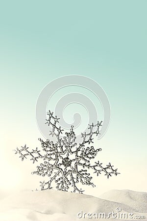 Sparkling snowflake in the snow Stock Photo