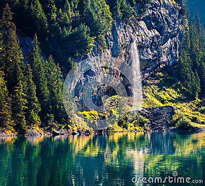 Sparkling waterfall on the Oeschinensee Lake. Splendid summer morning in the Swiss Alps, Kandersteg village location, Switzerland, Stock Photo