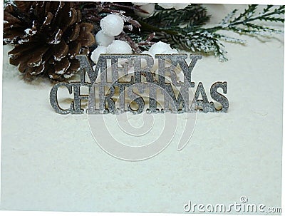 Silver sparkly Merry Christmas sign on snow Stock Photo