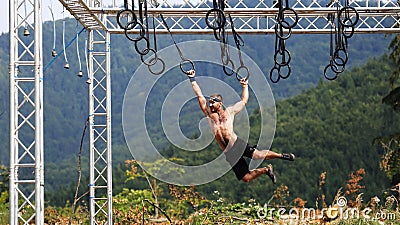 Spartan obstacle running race. Hurdle, man Editorial Stock Photo