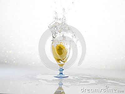 Spashing water on glass with lemon Stock Photo