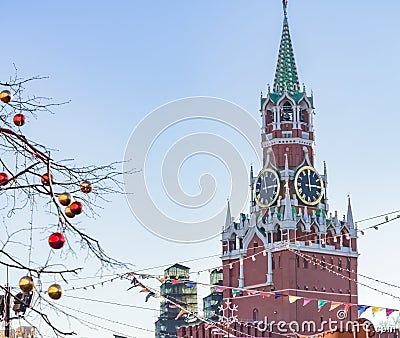 Spasskaya tower of Kremlin and festive decorations on Red Square in Moscow Stock Photo