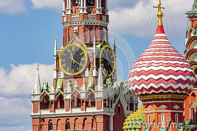 Spasskaya tower of Moscow Kremlin and a tower of Cathedral of Vasily the Blessed Saint Basil`s Cathedral, Russia Stock Photo