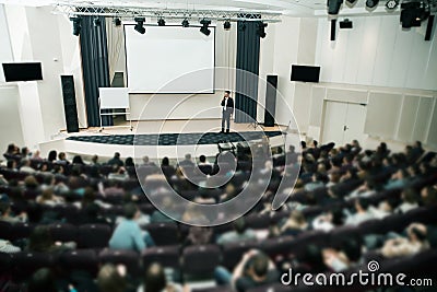 Speaker at Business Conference and Presentation. Audience the conference hall. Stock Photo