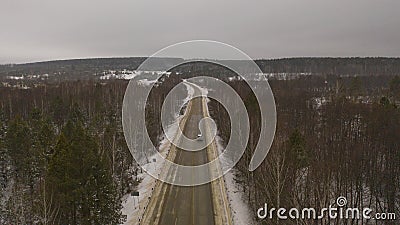 Removing snow on the track and sprinkling with sand and salt. snow removal. Snowplow for clearing snow from the track and spraying Stock Photo