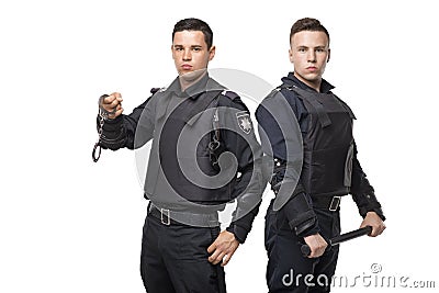 Special force troops with a baton and handcuffs Stock Photo