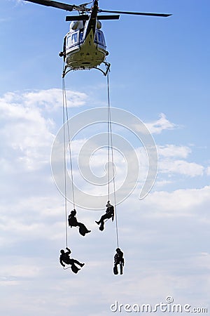 Special forces in helicopter with sky on background Stock Photo