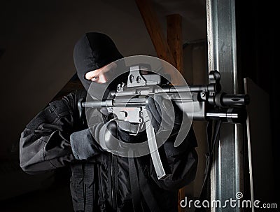 Special forces soldier is aiming and shooting on the target Stock Photo