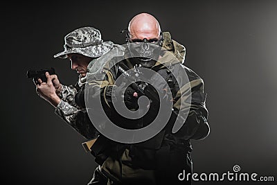 Special forces soldiers men with Machine gun on a dark background Stock Photo