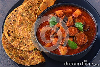 Methi Thepla and Gujarati ringan nu shaak, brinjal curry Stock Photo