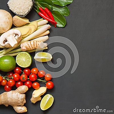 Special ingredients for popular Thai spicy soup Tom-yum kung lime, galangal, red chili, cherry tomato, lemongrass and kaffir lime Stock Photo