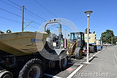 Special machines of yellow colour, designed to make construction and maintenance work on the track and road. Editorial Stock Photo