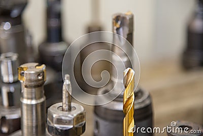 The special purpose drill tools coating by gold in the tool room. Stock Photo