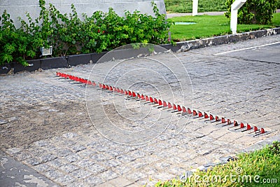 Special security pins against car's tires in the luxury hotel Stock Photo