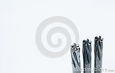 Special tools isolated on white background. Solid carbide end mill cutting tools by CNC milling cutter. Coated step drill. Stock Photo