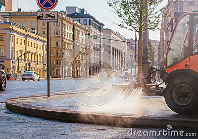 Special truck for city cleaning. Summer, dawn Editorial Stock Photo