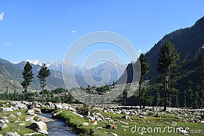 A special view of Kumrat Valley laks and stones among the mountains and trees KP Pakistan Stock Photo
