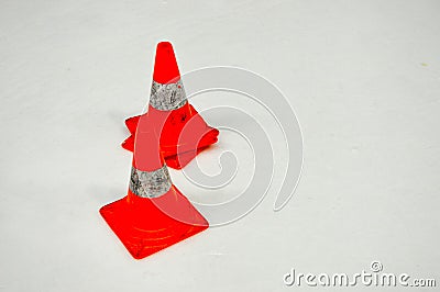 Special warning damaging plastic orange cones on white ice on ice hockey Stock Photo