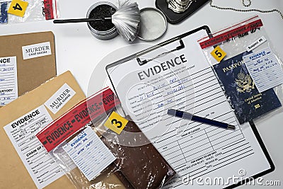 Specialised police officer takes wallet with money out of a murder evidence bag Stock Photo