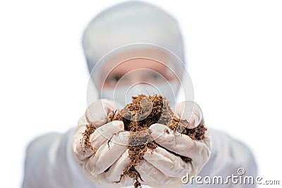 Specialist biologist holds a soil sample, hand in the focus Stock Photo
