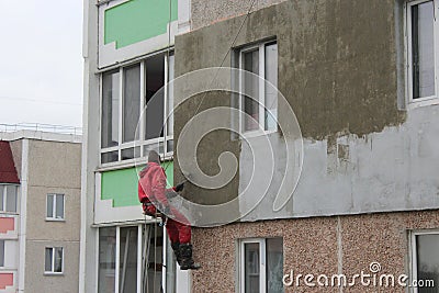 Specialist carring out warming of building Editorial Stock Photo