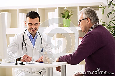 Specialist doctor and patient smiling and talking Stock Photo