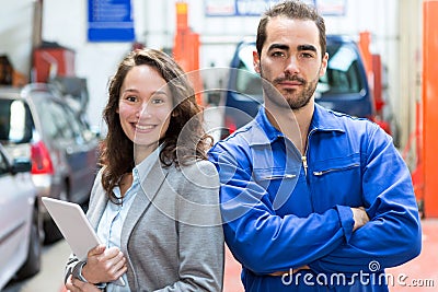 Specialist expert and mechanic at the garage Stock Photo