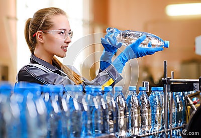 Specialist in factory checking bottles Stock Photo