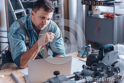 Specialist working in manufacturing plant Stock Photo