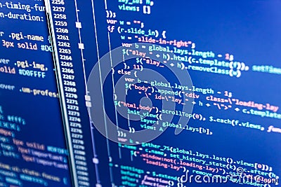 IT specialist workplace. Modern tech. Hacker api text on the computer screen. Stock Photo