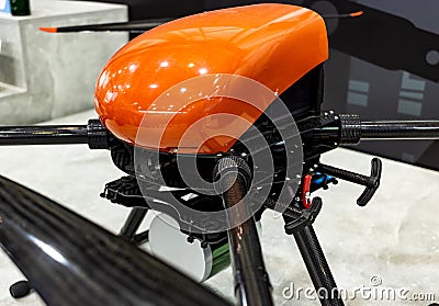 specialized industrial drone with red body with suspension close-up, selective focus, depth of field Stock Photo