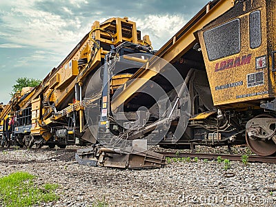 A specialized train that does ballast and roadbed maintenance for rail ways. Stock Photo
