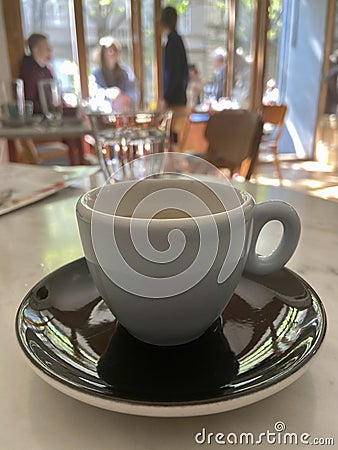 Cup of espresso black saucer marble like table Stock Photo