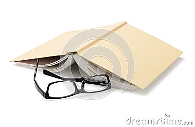 Spectacles Beside Inverted Book Stock Photo