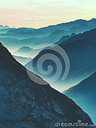 Spectacular aerial view of mountain silhouettes and misty valleys. Misty awaking of beautiful fairy valley Stock Photo