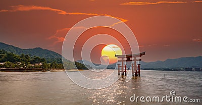 Spectacular composition of Miyajima Torii and sun Stock Photo