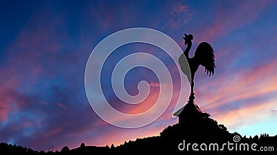 Spectacular dawn with cockerell weathervane and landscape. Red s Stock Photo