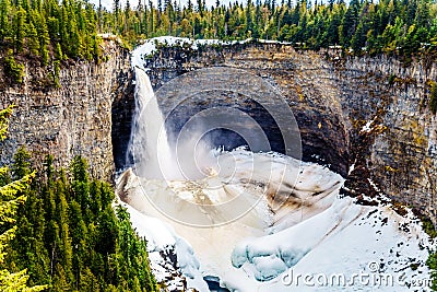 The spectacular ice and snow cone in winter at the bottom of Helmcken Falls on the Murtle River in Wells Gray Provincial Park Stock Photo